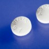 Close-up of aspirin pills on blue background