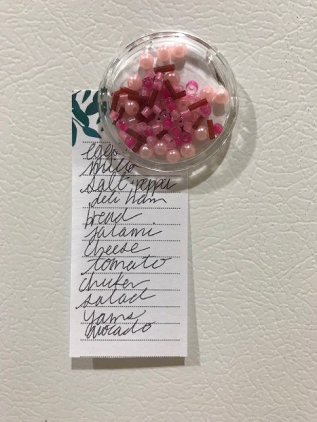 Clear Plastic Cap Magnets - bead filled magnet holding grocery list