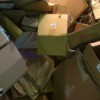 Closeup of used cardboard boxes piled up.
