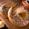 Everything bagels on a cutting board.