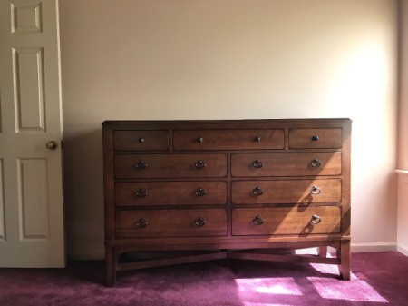 Gray Paint Color Advice to Coordinate with Burgundy Carpet - peek of carpet and chest of drawers