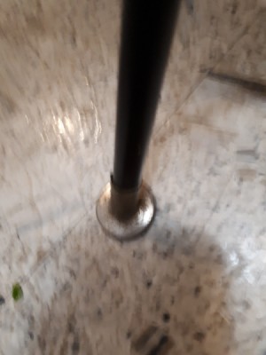 Buying Slide-on Feet for Wrought Iron Chairs - closeup of leg cap or foot