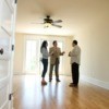 Couple speaking with property manger about renting a house