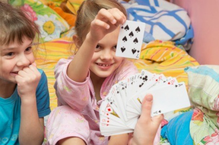 Kids playing with cards and learning math