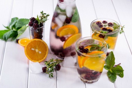 Herbs and fruits in chilled water care and glasses