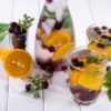 Herbs and fruits in chilled water care and glasses