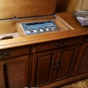 Value of a Vintage Stereo and Radio Console - stereo and radio in medium wood console cabinet