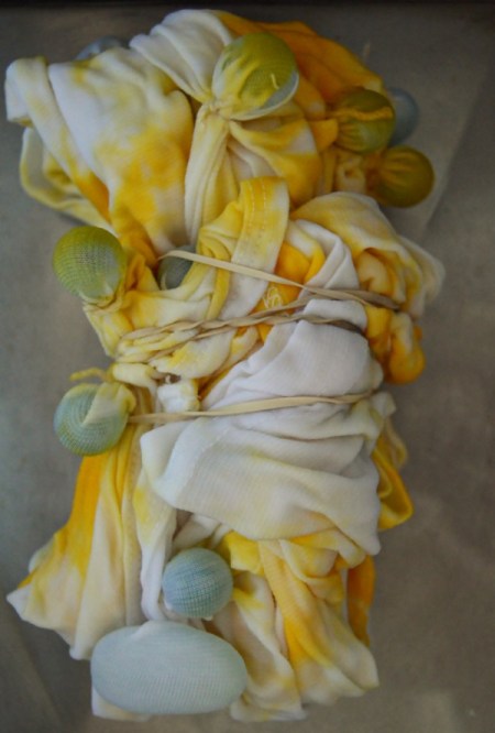 Flames of Love Tie Dye T-Shirt - after treating with the yellow dye and rinsing fold into a rectangle and tie again with twine and repeat dye step with the red