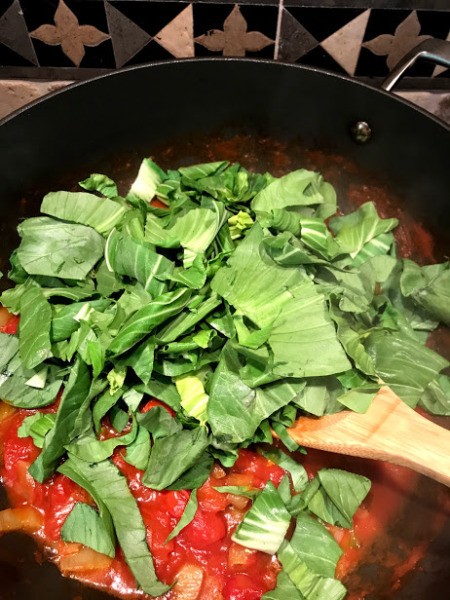 Bok Choy leaves added to pan