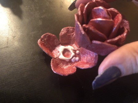 Egg Carton Rose Brooch - glue into the 4 petal piece and then into the final 4 petal piece using the same technique