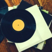 Stack of records on a wooden floor