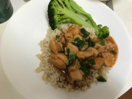 Orange Chicken on rice with broccoli on plate