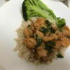 Orange Chicken on rice with broccoli on plate