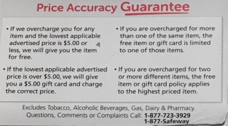 A Price Accuracy Guarantee sign at a grocery store.