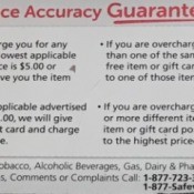 A Price Accuracy Guarantee sign at a grocery store.