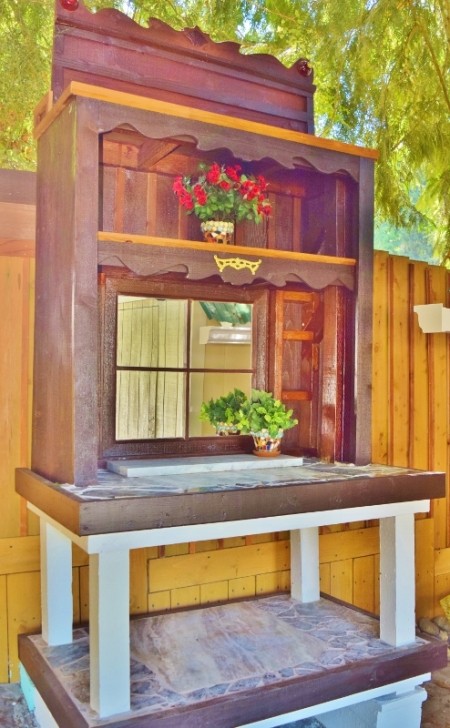 A small potting bench in a backyard.