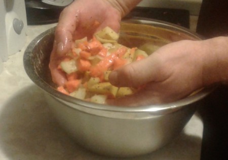 mixing vegetables with hands