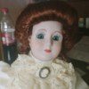 Identifying a Porcelain Doll - period doll with lace ruffle and cameo