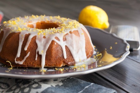 Bundt cake glazed and topped with lemon zest.