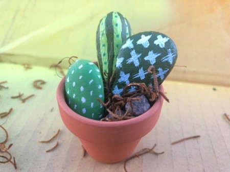 Decorative Stone Cactus - fill the pot 3/4s with stones, use moss to prop up the stone cactus - optional pom flowers can be added now