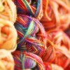 Stacks of colorful knitting yarn