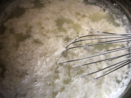 milk separating into curds and whey
