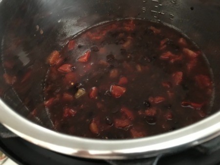 beans, tomatoes and broth in pan