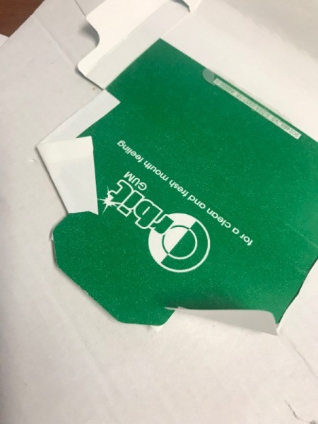 Upcycled Business Card Holder from Gum Packaging - folding parts of label to fit