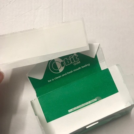 Upcycled Business Card Holder from Gum Packaging - cover gum logo with sticker
