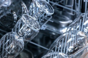 Shiny dishwasher with clean wine glasses