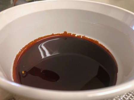 Caramel poured in bottom of ramekin