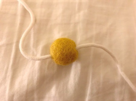 Toddler Felt Ball Necklace - pull ball onto the yarn