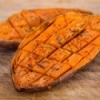 Baked sweet potato cut into cubes with in the skin.