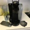 A preowned Keurig coffee maker in a kitchen.