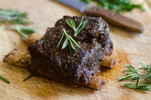 Short ribs on a cutting board.