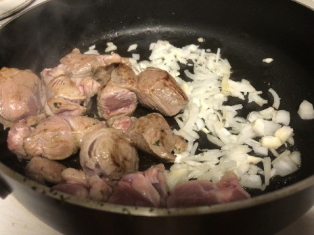 adding onions to meat