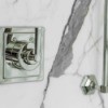 Closeup of a marble shower.