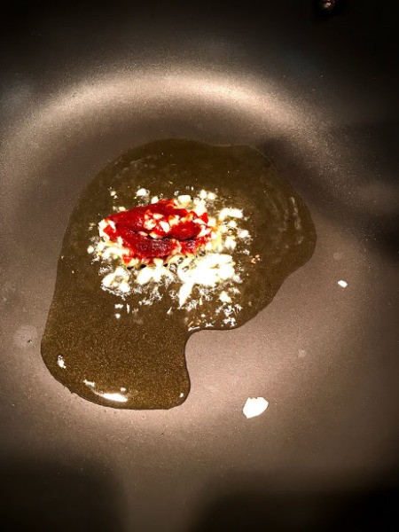 oil, garlic and spice in pan