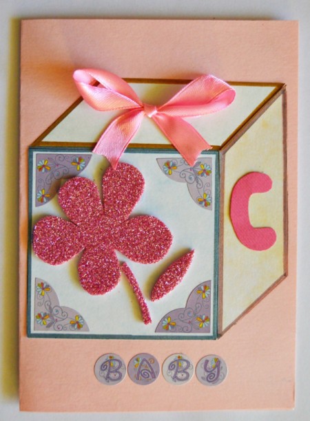 Baby's Toy Cube Card - make a bow and glue to top panel