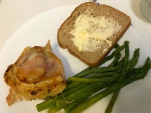 Duck Sauce Chicken on plate with asparagus and bread
