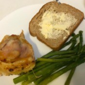 Duck Sauce Chicken on plate with asparagus and bread