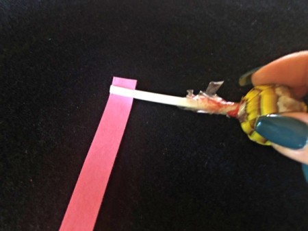 DIY Lollipop Paper Quilling Tool - after stick cools insert paper strip and pull up even with the end of the stick