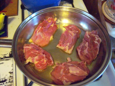 searing chicken in a skillet