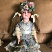 Identifying a Porcelain Doll - doll in print dress with lace