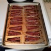A pan of turkey bacon cooked in the oven.