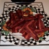 A plate of cooked turkey bacon.