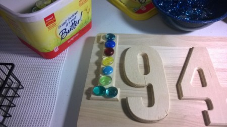 House Address Sign Using Glass Nuggets - arrange glass nuggets on the numbers, set nuggets aside and paint the sign and numbers