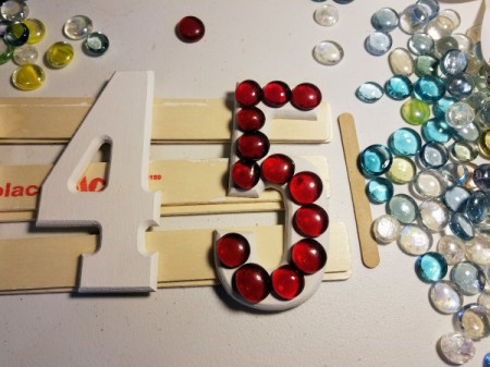 House Address Sign Using Glass Nuggets - number five with all red glass nuggets