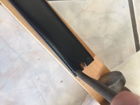 Reconstructed Belt on a Budget - use punch and hammer to make new holes