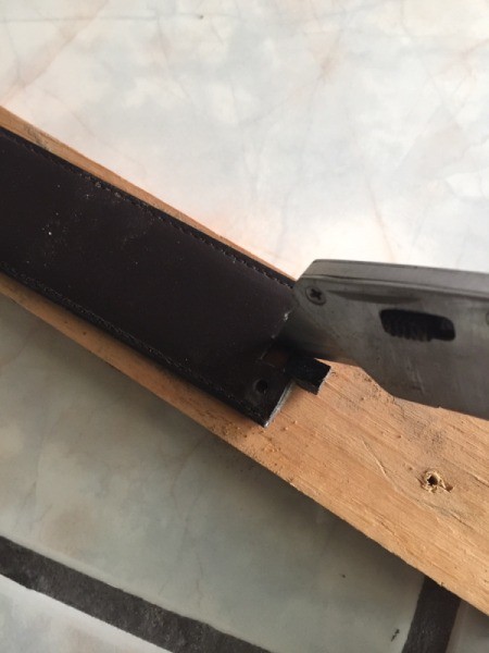 Reconstructed Belt on a Budget - use the knife to cut out the belt end